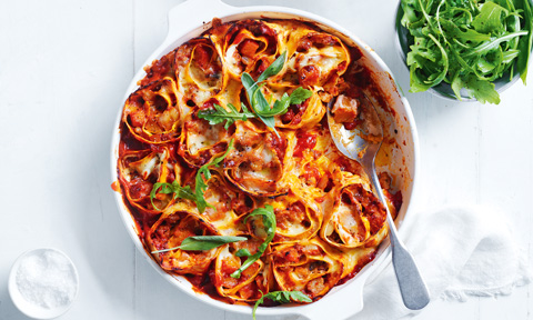 Pumpkin and sausage rotolo with salad leaves