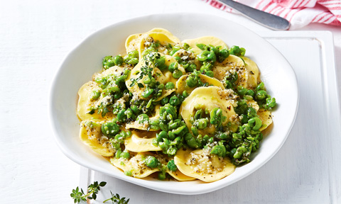 Pumpkin ravioli with peas and garlic butter sauce