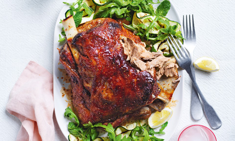 Slow-roasted maple and bourbon lamb shoulder with zucchini ribbons and salad leaves