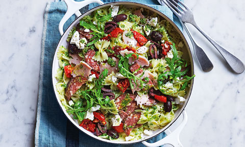 Quick antipasto pasta with basil and rocket leaves