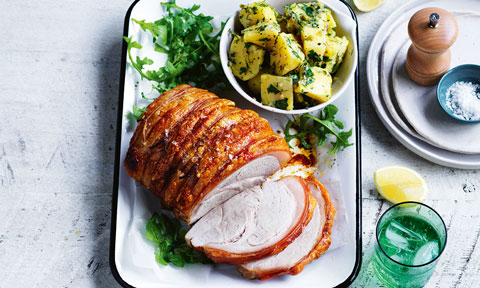 Thickly sliced roast pork leg with warm herbed potato salad 