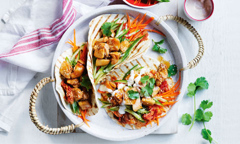 Four spicy Korean-style chicken tacos