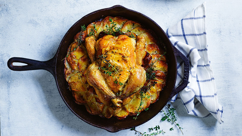 Crispy skillet potatoes and chicken in the pan