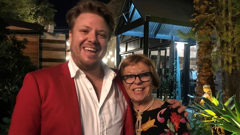 Michael Weldon standing with his mum