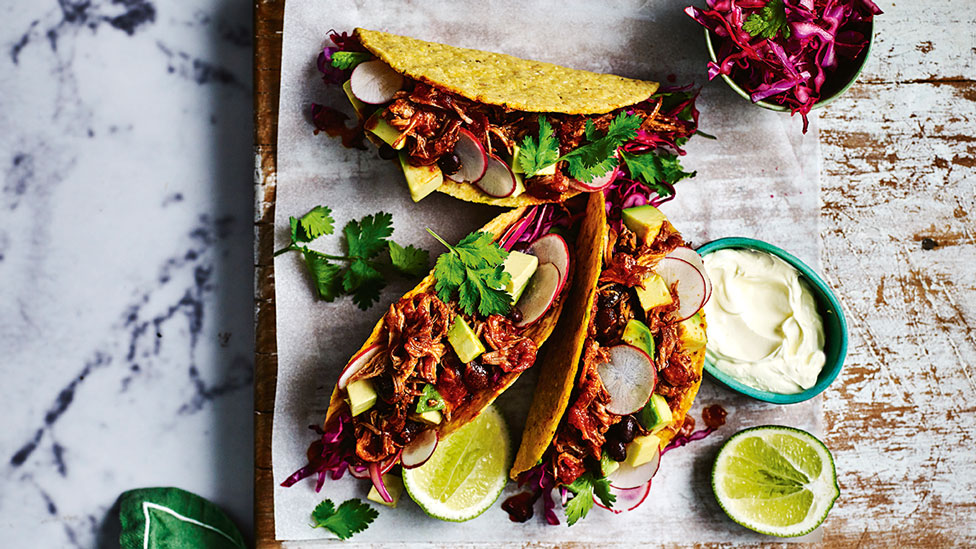 Spicy pulled pork and black bean tacos 