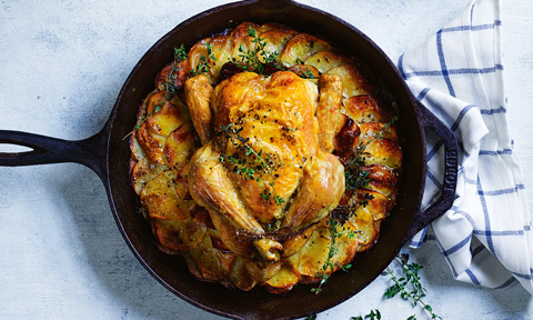 Crispy skillet potatoes and chicken in the pan