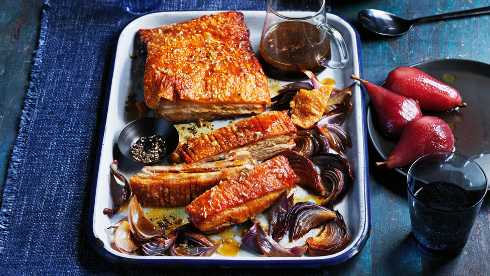 Slow-roasted pork belly with red wine poached pear salad