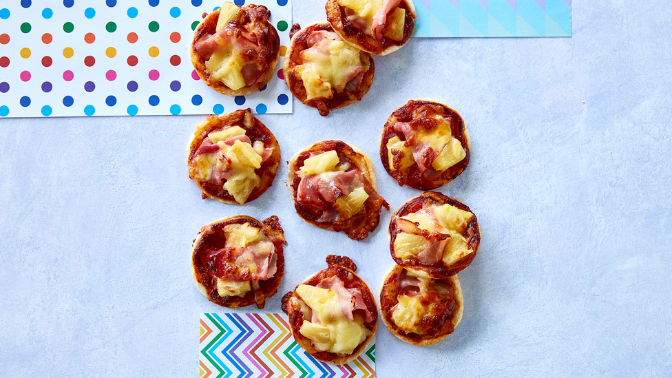 Several delicious pizza bites laid out on a table.