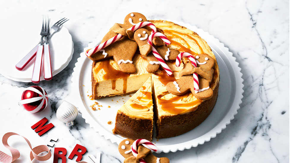 A gingerbread cheesecake served around christmas decorations