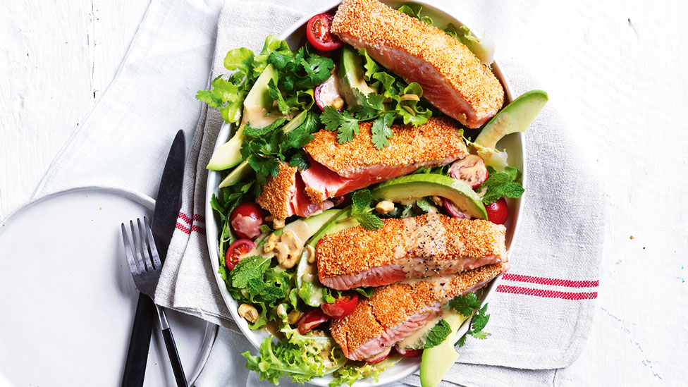 Sesame crusted miso salmon on a bed of veggie salad