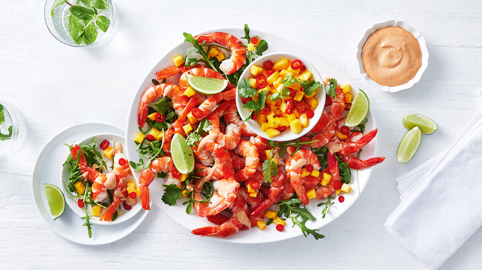 A tray of prawns served with mango salsa