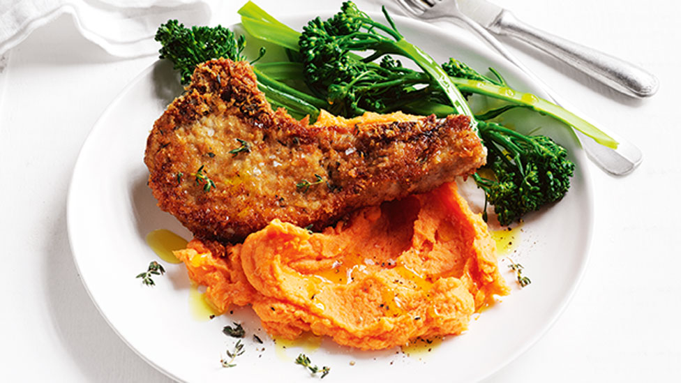 One serve of Parmesan pork with creamy sweet potato mash and fresh broccoli.