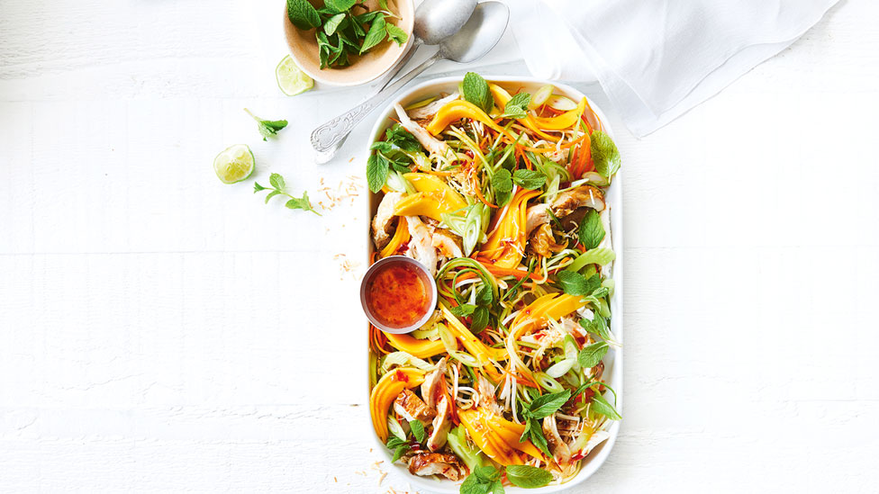 Asian-style chicken and mango salad with carrot, cucumber and bean sprouts