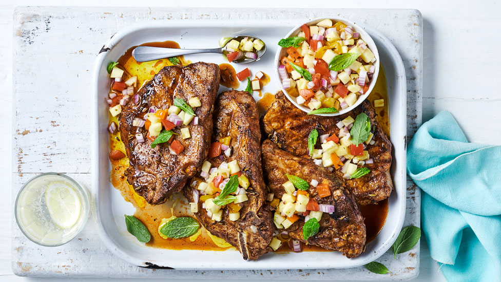 Four BBQ pork chops with pineapple salsa