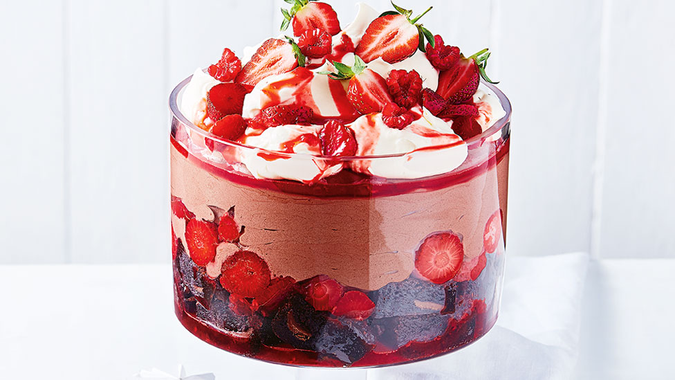 Chocolate brownie trifle with strawberries, blueberries and raspberries