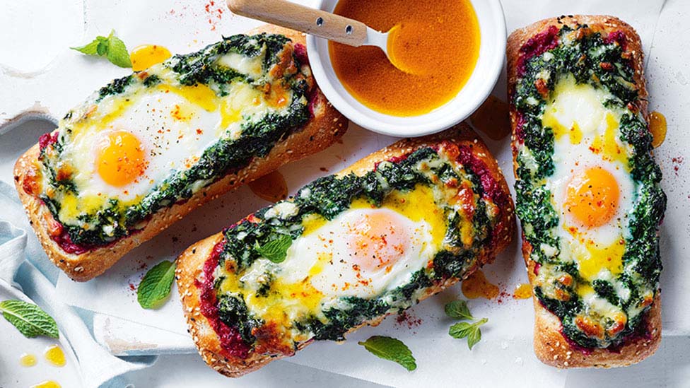 Crusty pide bread with spinach and eggs