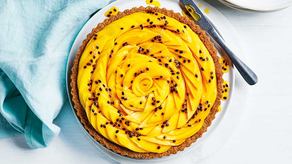 Mango and white chocolate cheesecake tart with passionfruit mixture