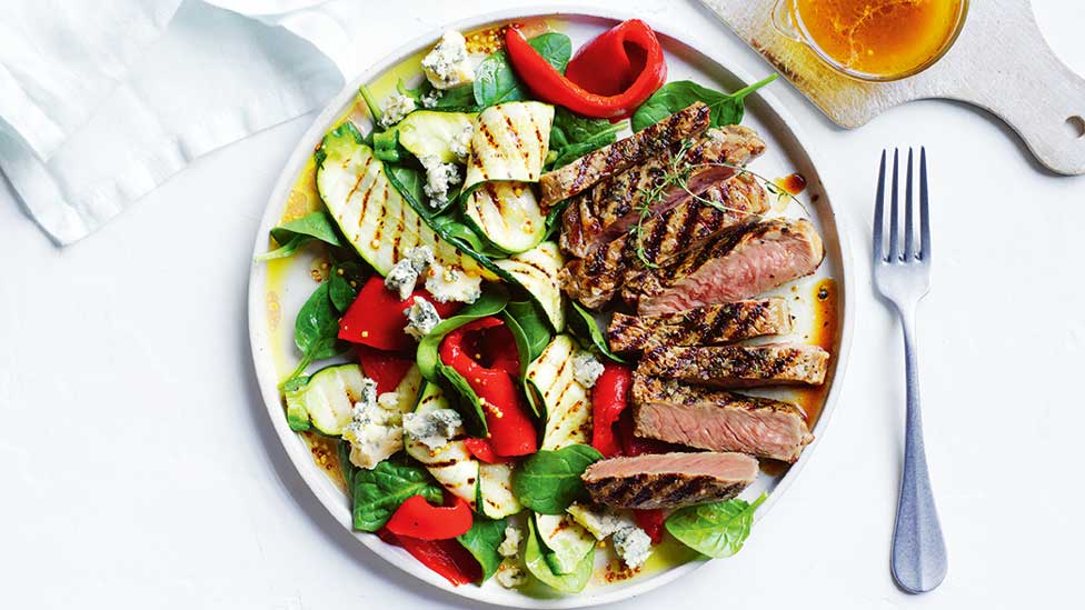 Thyme leaves and zucchini salad with thickly sliced beef