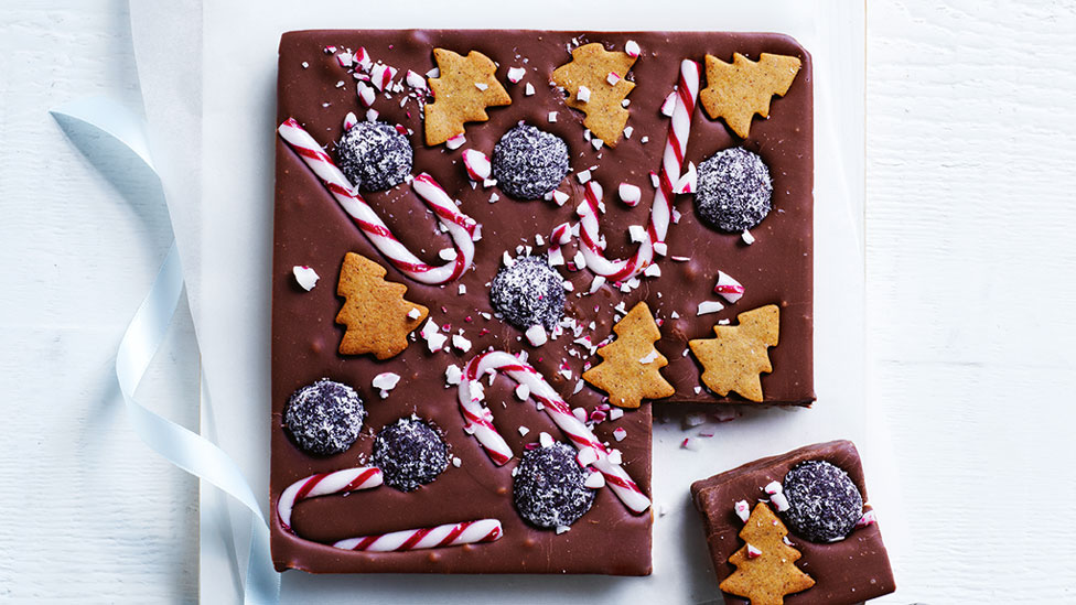 Christmas themed rum ball fudge with a slice cut out.