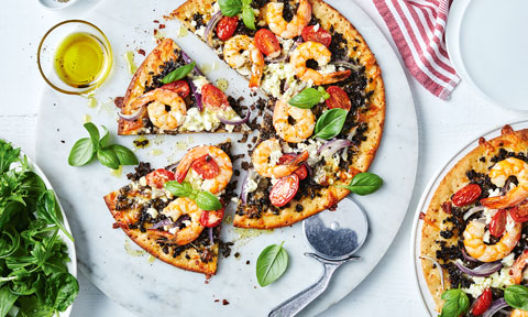 Garlic mushroom mince and prawn pizza cut into wedges