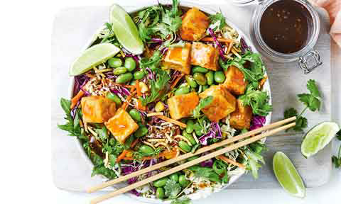 Salad mixture topped with Asian-style tofu cubes