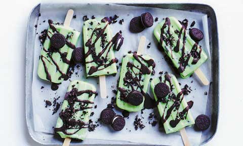 Six choc-mint cookies and cream ice blocks on a baking tray