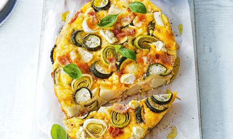 Zucchini, leek and potato frittata with bacon and tomatoes