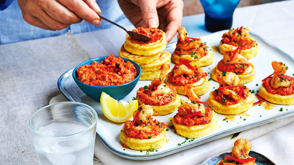 Corn blinis with prawns and romesco sauce