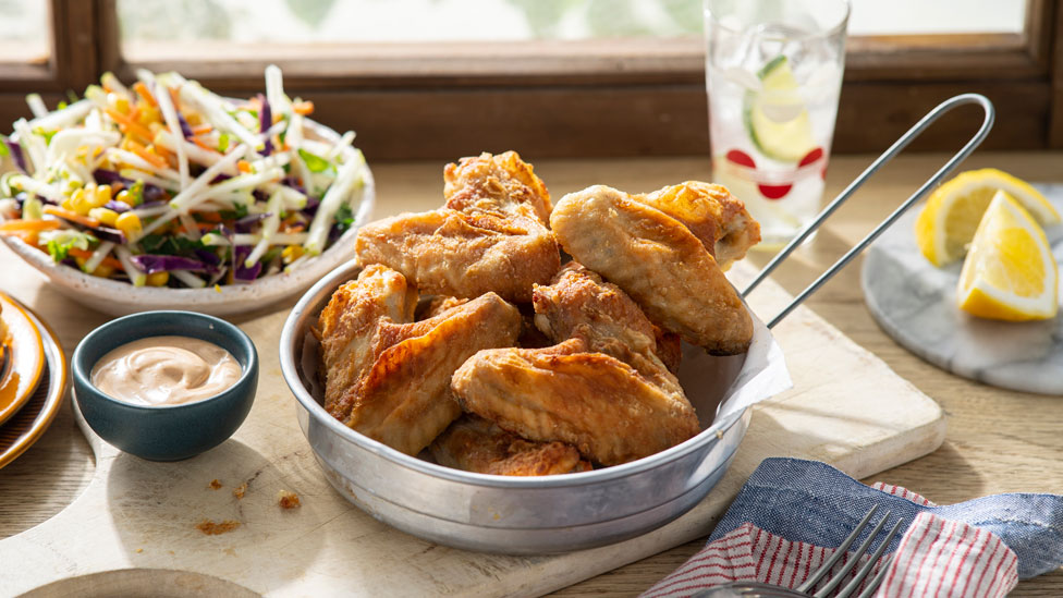 Crispy chipotle chicken wings with apple slaw
