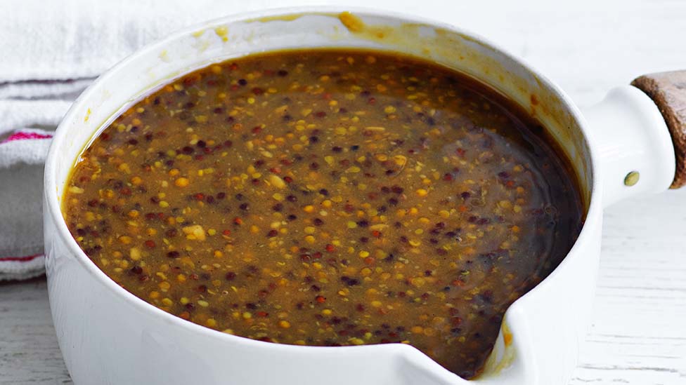 Brown sugar and mustard glaze in a saucepan