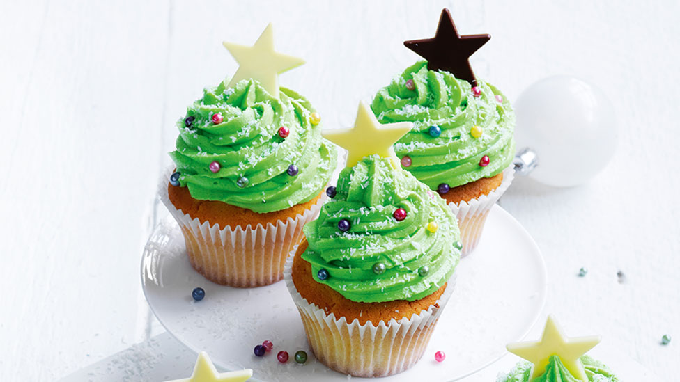 Three Christmas tree cupcakes.