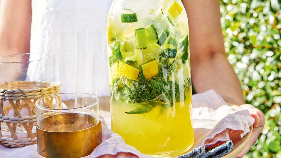 Cucumber, lime and basil spritz in a large jug