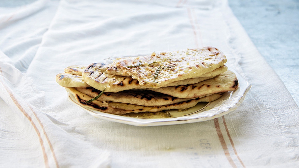 Grilled flatbread on a dish.