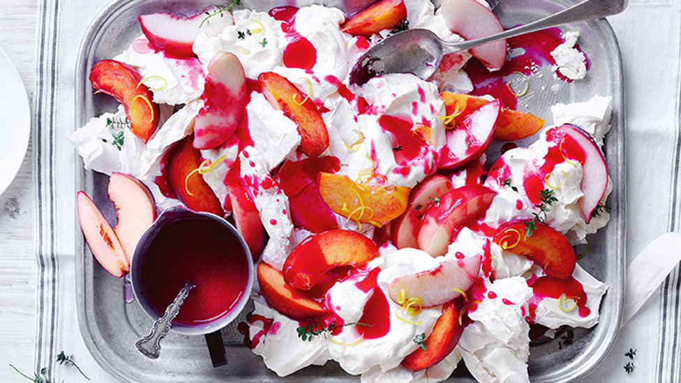 Curtis’ peach and mascarpone smashed pavlova on a platter with raspberry sauce