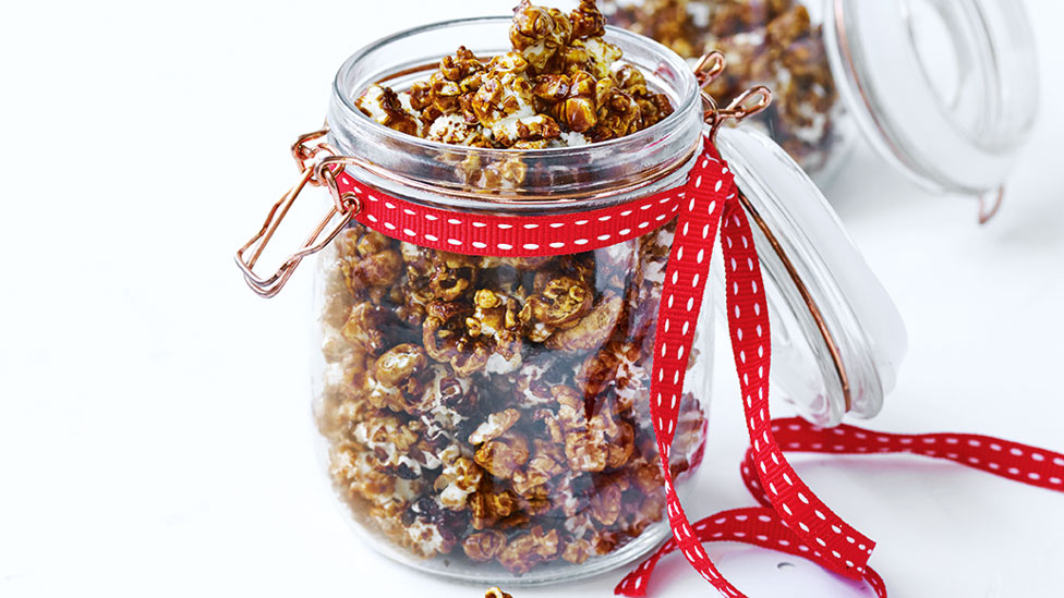 A jar of gingerbread spice caramel popcorn