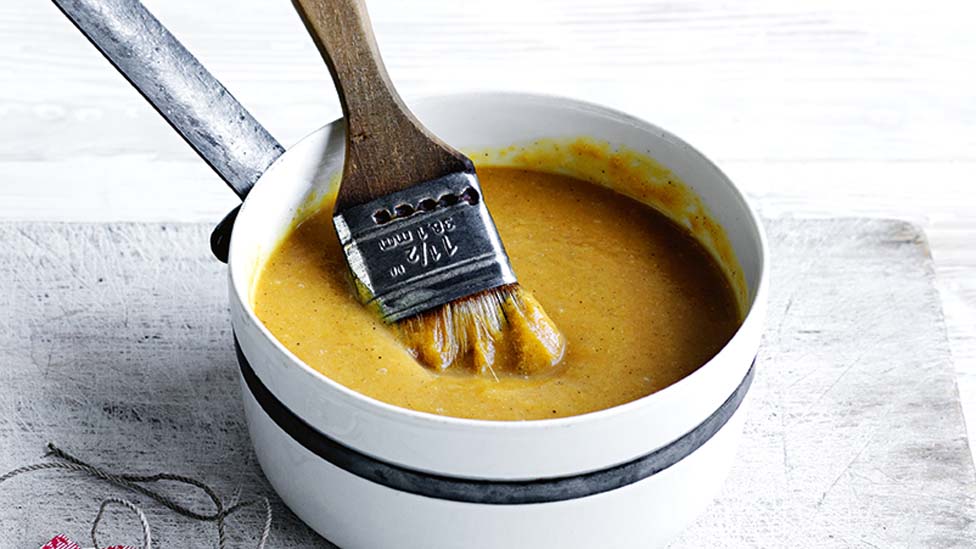 Peach and rum glaze in a saucepan