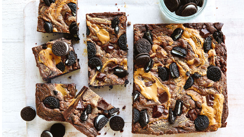 A baking tray of peanut butter and oreo cookies