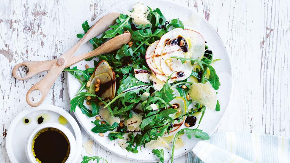 Pear, rocket and parmesan salad drizzled with balsamic glaze