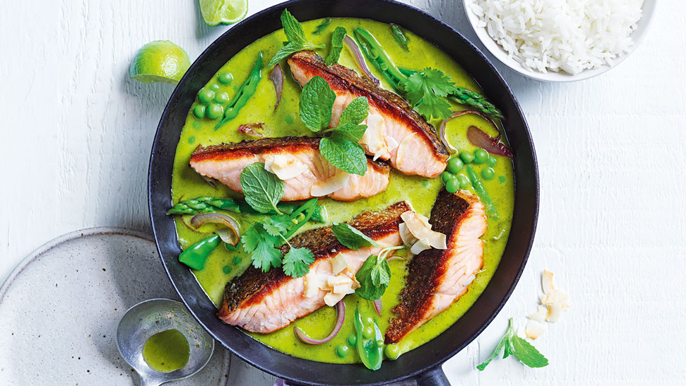 Salmon and snow pea green curry in a bowl