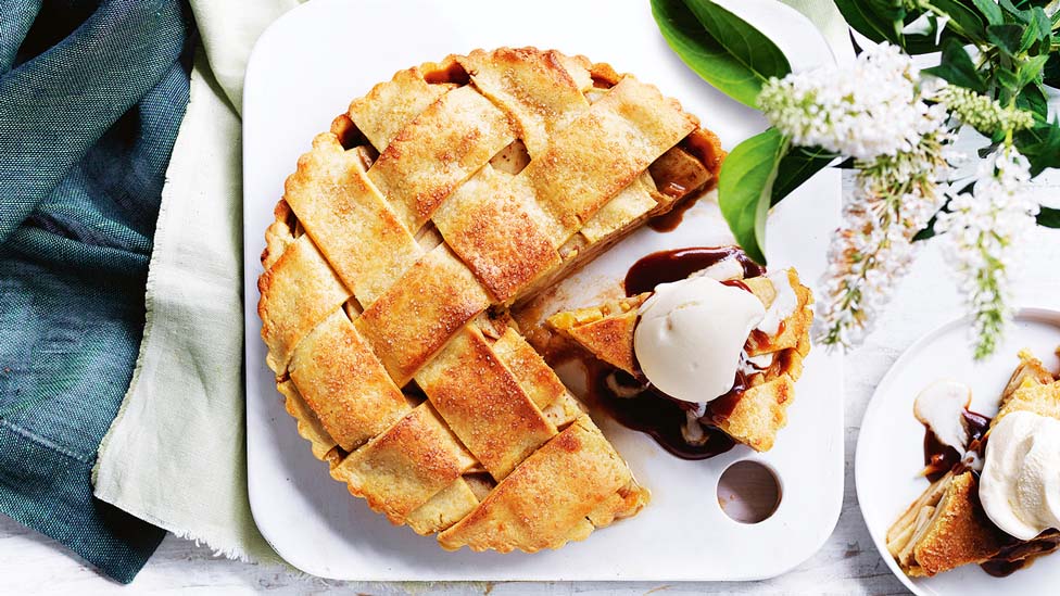 A salted caramel apple pie served with ice cream