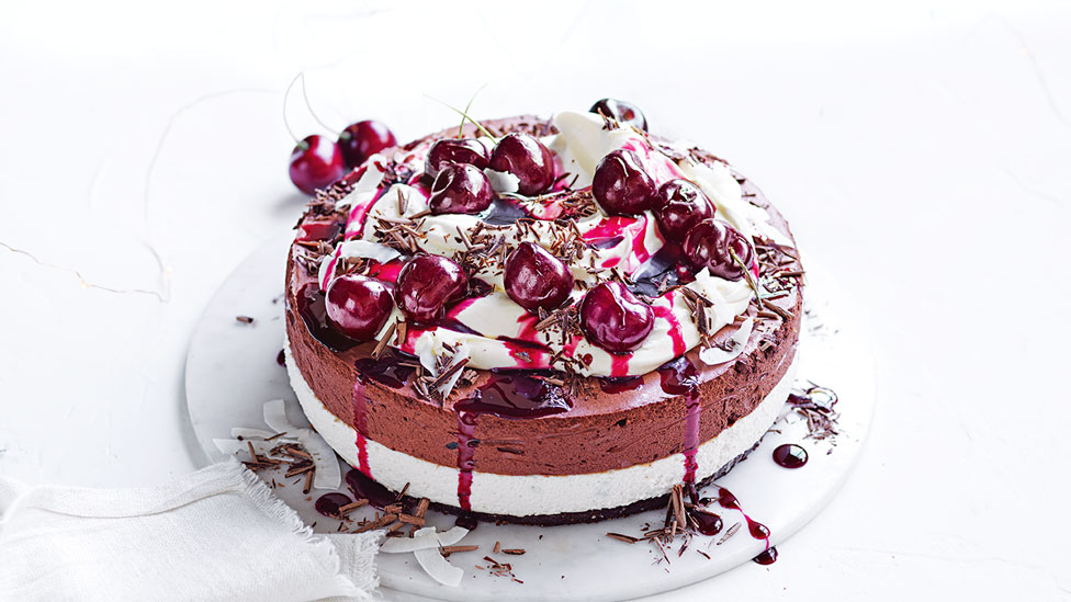 Chocolate and cherry mousse cake on a dish.