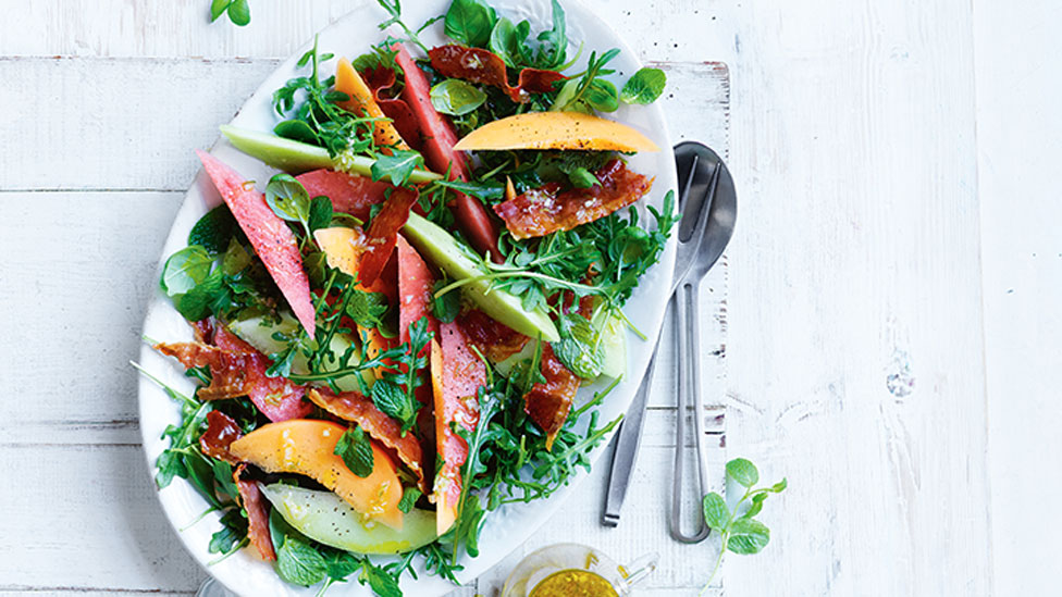 Crispy prosciutto and melon salad on a dish.