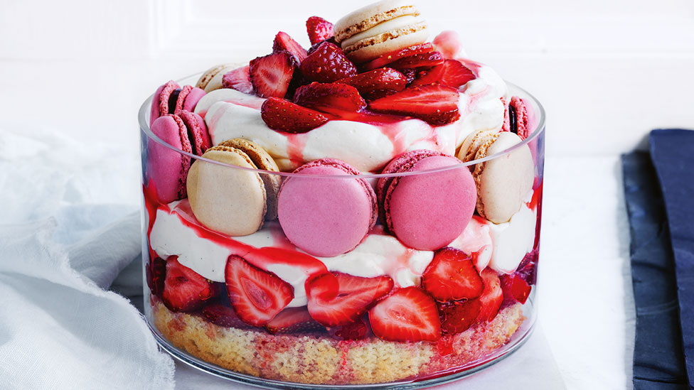 Strawberries and cream trifle in a dish.