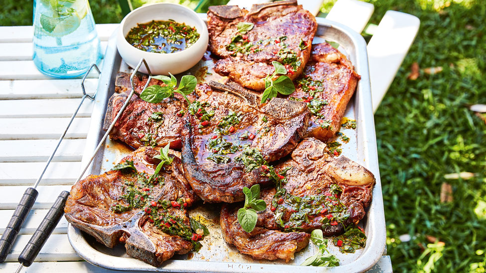 Six BBQ T-bone steak with chimichurri on a plate