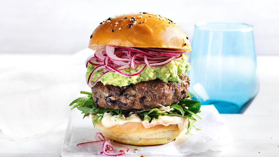 Mexican-style beef and bean burgers with avocado and read onion