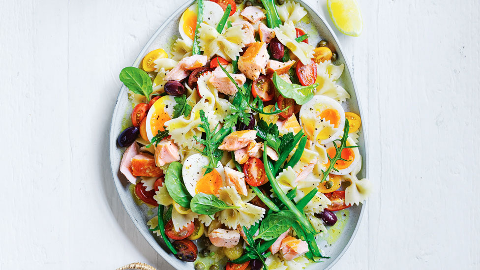 Salmon Nicoise pasta salad with eggs cut in halves