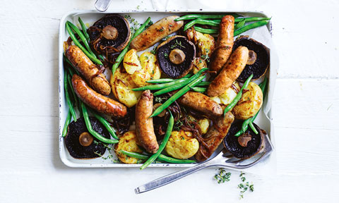Bangers, flat mushrooms and smashed potato tray bake