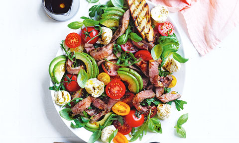 Beef tomato and bocconcini salad served on a plate