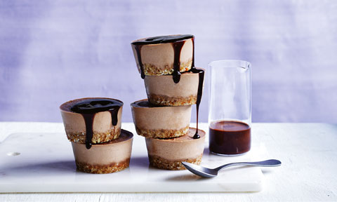 A stack of raw peanut butter chocolate cheesecakes