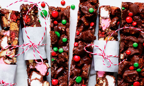 Several pieces of Christmas rocky road on a dish.